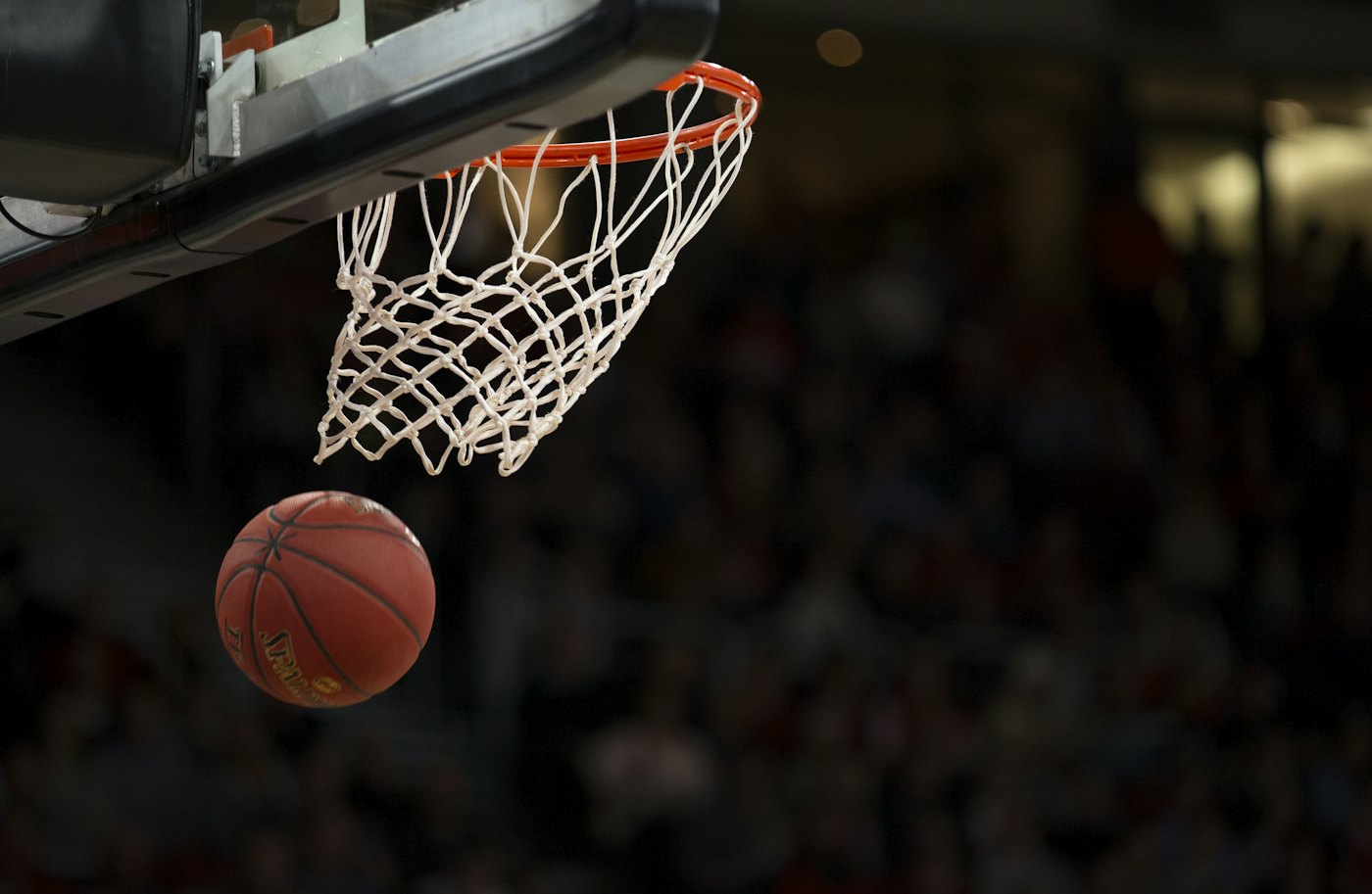 Basketball player shooting on a court
